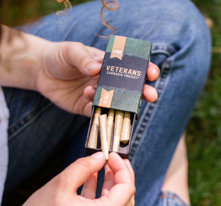 Pulling a preroll out of a Veteran's Cannabis Project Pack