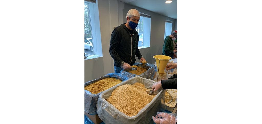 Curaleaf MA President, Patrik, making meals for those in need